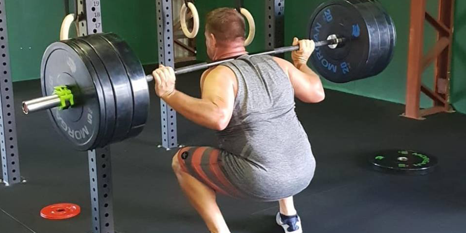 Here’s How to Squat with Proper Form, Using a Barbell